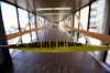 TREVOR HAGAN / WINNIPEG FREE PRESS
Police tape blocking the skywalk between the Millennium Library and the Police Headquarters following a shooting, Monday.