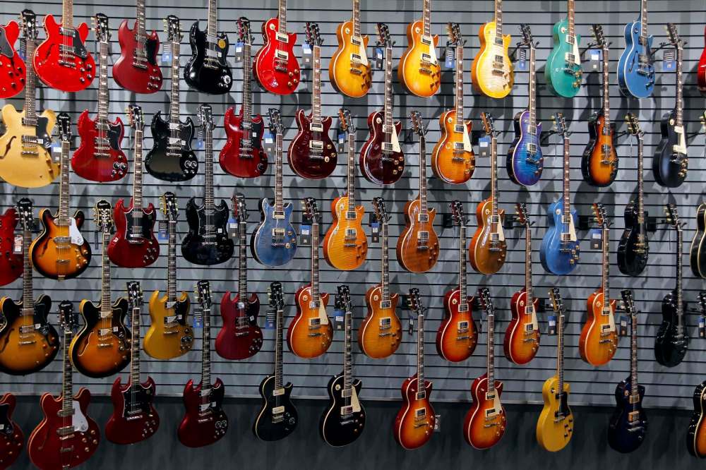 PHOTOS BY BORIS MINKEVICH / WINNIPEG FREE PRESS
Long & McQuade’s new flagship store welcomes customers with 350 guitars on a free-floating, curved wall as they enter the building.