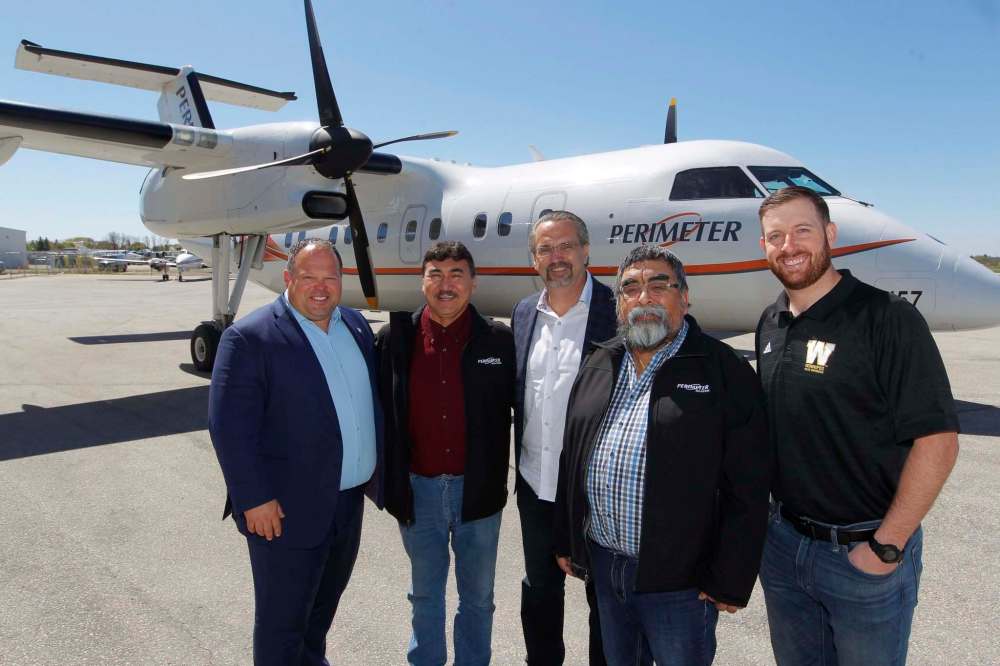 photos by BORIS MINKEVICH / WINNIPEG FREE PRESS
Above: Blue Bombers president Wade Miller (from left), Northlands Denesuline First Nation Chief Joe Antsanen, Exchange Income Corp. president Mike Pyle, Bunibonibee Cree Nation Chief Timothy Muskego and Bombers quarterback Matt Nichols announce a community program for First Nations youth from 12 northern communities.
Left: Nichols and Chief Antsanen.