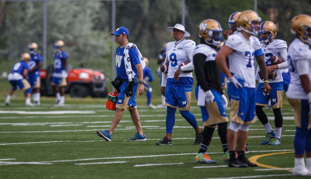 MIKE DEAL / WINNIPEG FREE PRESS
Winnipeg Blue Bombers athletic therapist Alain Couture walks the field during training camp at the University of Manitoba on Wednesday.