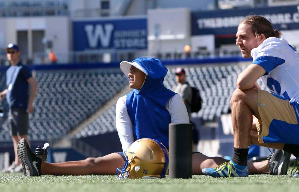 WAYNE GLOWACKI / WINNIPEG FREE PRESS
Félix Ménard-Brière (right) says he’s watching everything veteran Justin Medlock does at Blue Bombers training camp.
