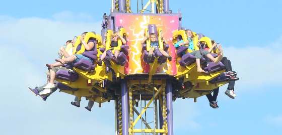 Bruce Bumstead / Brandon SunRiders grip their shoulder restrains as they fall earthbound on the Mega Drop ride.