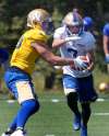 WAYNE GLOWACKI / WINNIPEG FREE PRESS
Bombers QB Dan LeFevour on a fake handoff play with wide receiver Weston Dressler at the Winnipeg Blue Bombers training camp.