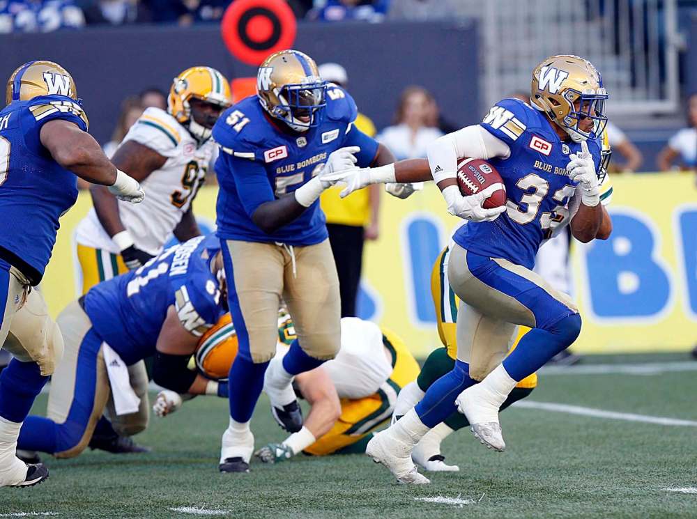 PHIL HOSSACK / WINNIPEG FREE PRESS
Winnipeg Blue Bombers running back Andrew Harris takes the ball upfield during Thursday night’s pre-season game against the Edmonton Eskimos at Investors Group Field.