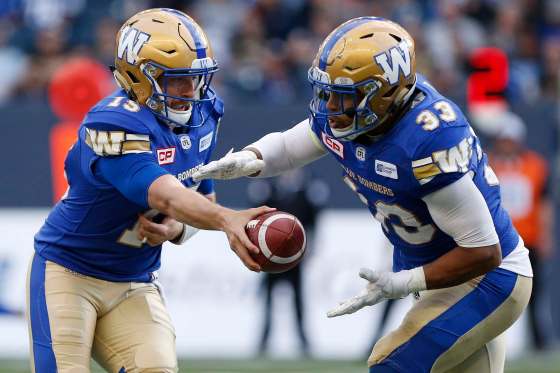 THE CANADIAN PRESS / John WoodsWinnipeg Blue Bombers quarterback Matt Nichols hands off to Andrew Harris during the first half against the Edmonton Eskimos, Thursday.
