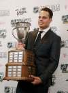 Auston Matthews of the Toronto Maple Leafs holds the Calder Memorial Trophy after winning the award during the NHL Awards, Wednesday, June 21, 2017, in Las Vegas. (AP Photo/John Locher)