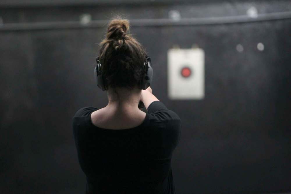 PHOTOS BY RUTH BONNEVILLE / WINNIPEG FREE PRESS
Free Press columnist Jen Zoratti tries out a shotgun that discharges fiery blanks during a gun training session at Winnipeg’s Gateway Gun Club.