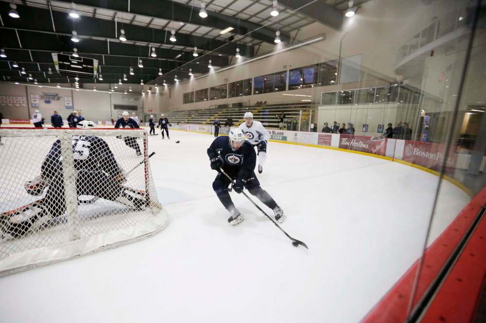 JUSTIN SAMANSKI-LANGILLE / WINNIPEG FREE PRESS
Jansen Harkins skates around the net during a drill at Jets development camp Thursday at the Bell MTS Iceplex.