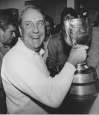DAVE BUSTON / THE CANADIAN PRESS FILES
Winnipeg Blue Bombers coach Cal Murphy holds the Grey Cup after his team beat the Hamilton Tiger-Cats in the Grey Cup game in Edmonton, Nov. 18, 1984.