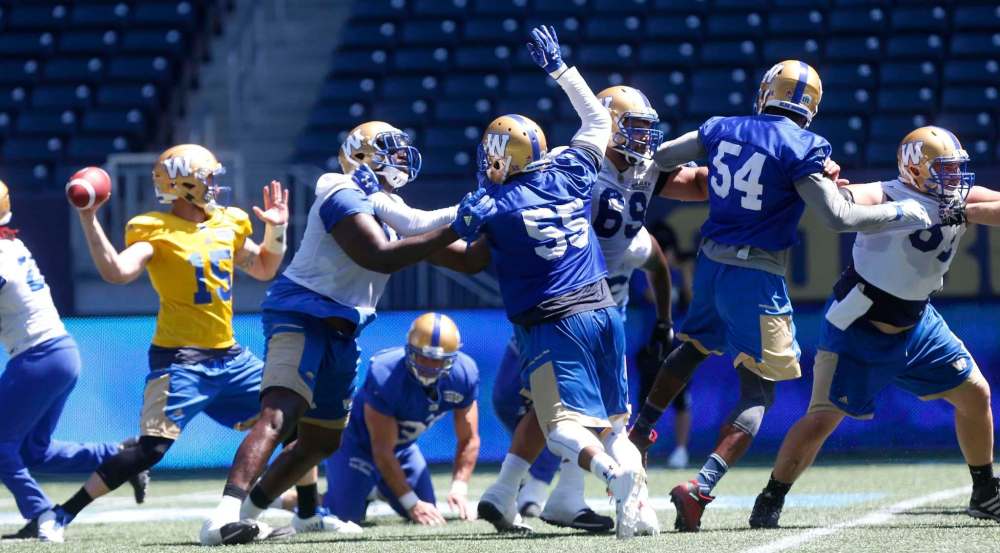 WAYNE GLOWACKI / WINNIPEG FREE PRESS
The Bombers’ defensive line puts pressure on QB Matt Nichols during practice at Investors Group Field Wednesday in preparation for Friday’s home opener against Calgary.