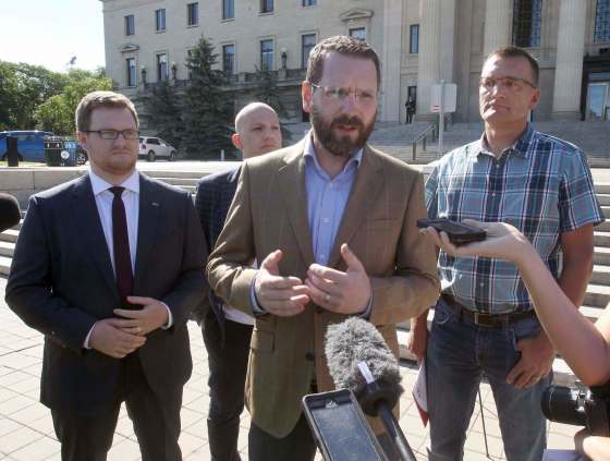 JOE BRYKSA / WINNIPEG FREE PRESSTodd MacKay (front centre) and Jonathan Alward (from left), Jim Karahalios and Gunter Jochum were on hand for the protest Thursday afternoon on the steps of the legislature.