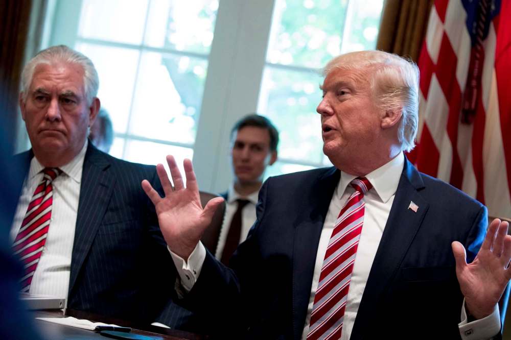 Andrew Harnik / The Associated Press files
Russell says U.S. Secretary of State Rex Tillerson (left) sponsored a huge disinformation campaign to discredit environmental protection.
