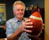 BORIS MINKEVICH / WINNIPEG FREE PRESS 
Former Blue Bomber Joe Poplawski poses on Wednesday with an inscribed game ball given to him for his part in a miracle comeback against Ottawa on Sept. 9, 1978.