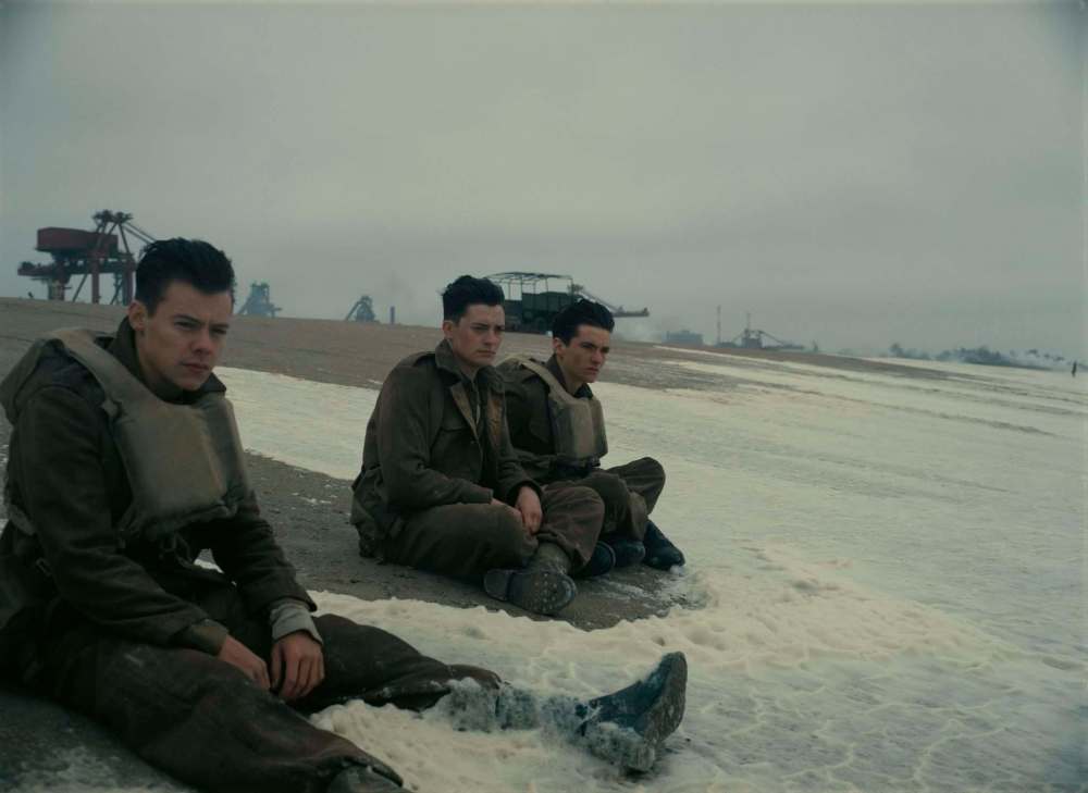 Harry Styles (from left) Aneurin Barnard and Fionn Whitehead in a scene from Dunkirk. (Warner Bros Pictures)