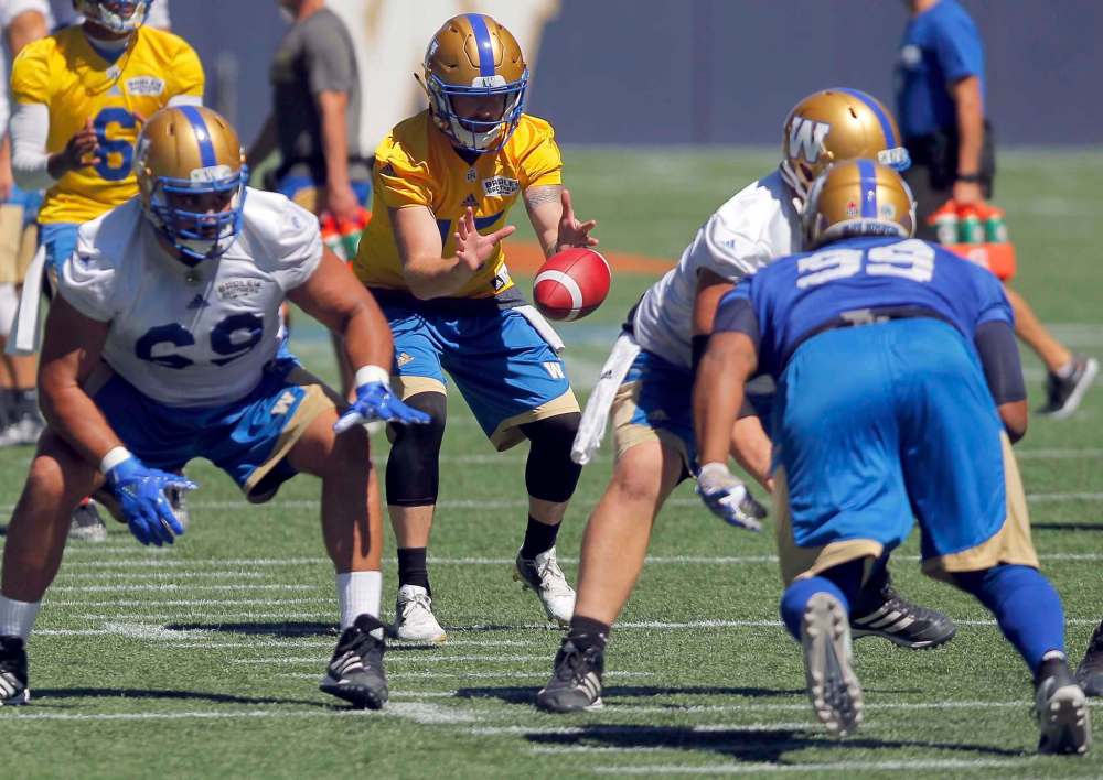 BORIS MINKEVICH / WINNIPEG FREE PRESS
Bombers quarterback Matt Nichols takes a snap in practice at Investors Group Field on Tuesday.