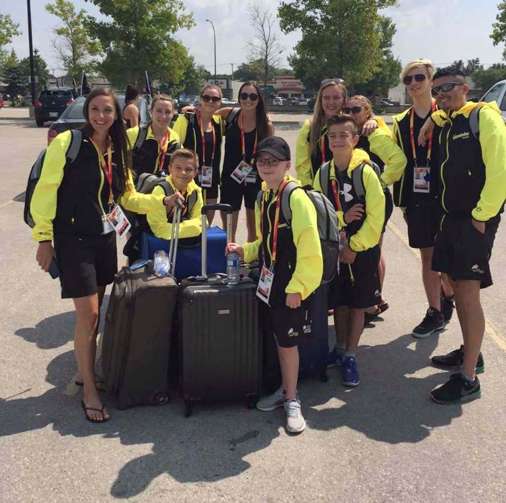 JASON BELL / WINNIPEG FREE PRESS
Attila Bernatsky (front with glasses) and coach Dallas Ludwick (front left), with the rest of the Manitoba diving team.