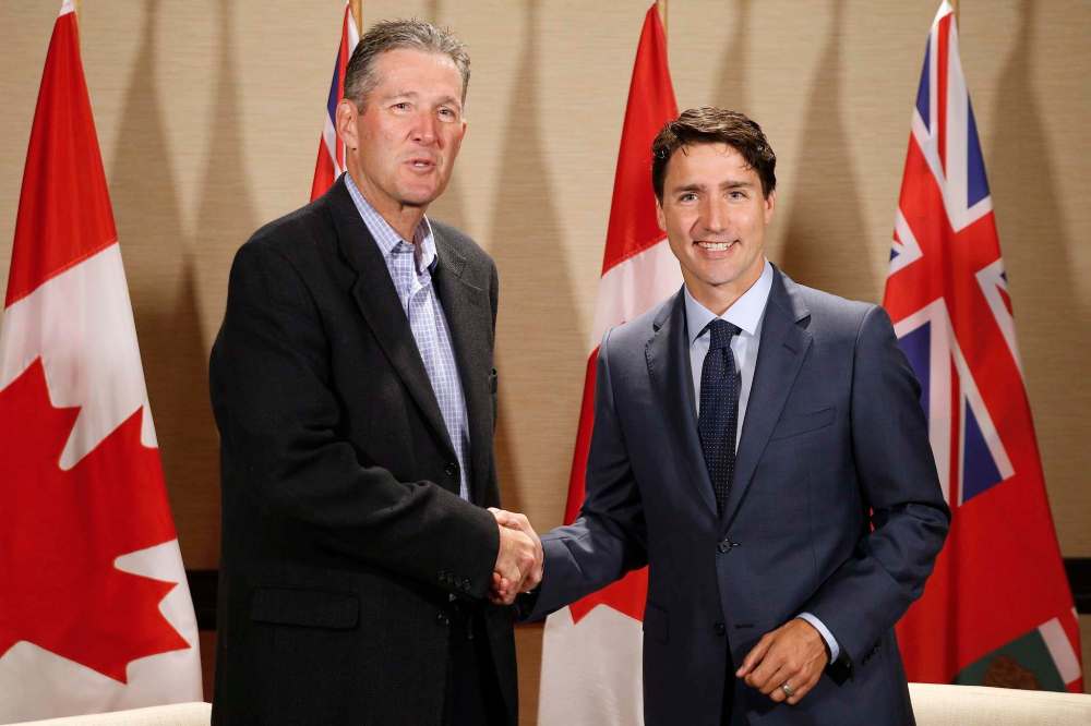Prime Minister Justin Trudeau meets with Manitoba Premier Brian Pallister in Winnipeg on Saturday, July 29, 2017. THE CANADIAN PRESS/John Woods