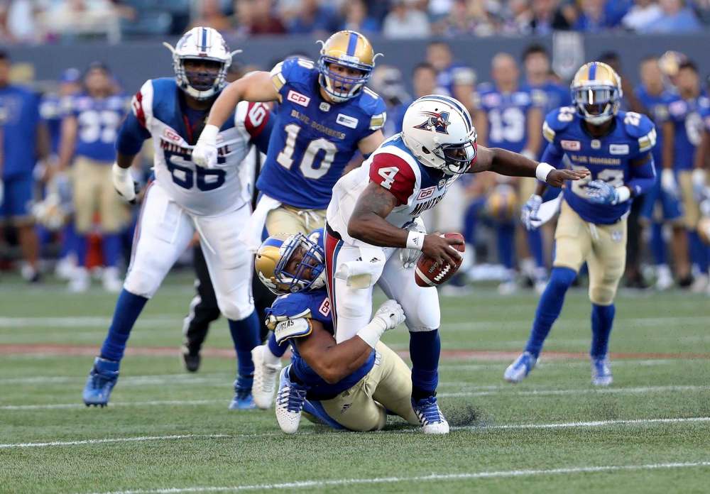 Winnipeg Blue Bombers defensive end Jackson Jeffcoat (94) sacks Montreal Alouettes quarterback Darian Durant (4) during the first half of CFL football action in Winnipeg on Thursday, July 27, 2017. THE CANADIAN PRESS/Trevor Hagan