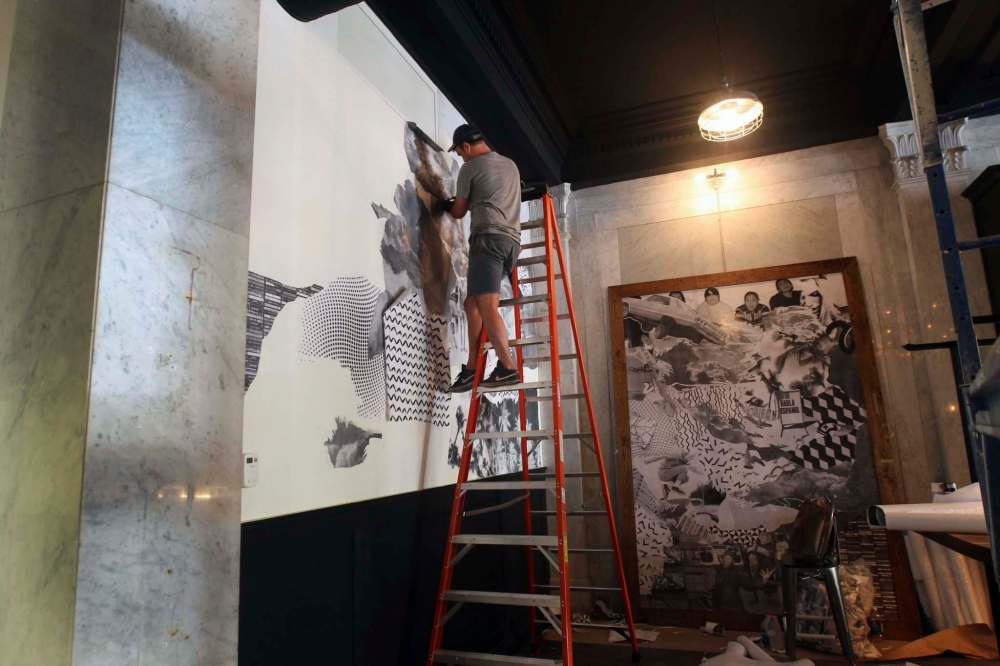 JOE BRYKSA / WINNIPEG FREE PRESS
Toronto artist Jahn Page uses a wheat-pasting technique to make giant murals for the La Carnita restaurant. The space was previously occupied by the Fox & Fiddle.