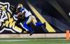 Winnipeg Blue Bombers receiver Davin Adams makes an acrobatic touchdown catch over Hamilton Tiger-Cats defensive back Don Unamba on Saturday. (Aaron Lynette / The Canadian Press files)