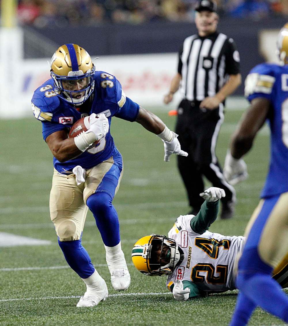 PHIL HOSSACK / WINNIPEG FREE PRESS
Andrew Harris leaves Eskimo DB Brandyn Thompson in his wake as he rumbles down field in the third quarter, Thursday.