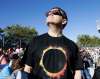 Don Ryan / The Associated Press
An eclipse watcher looks skyward in Oregon.