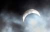 The partial eclipse is visible for a few moments during a break in the clouds on Monday afternoon. About 70 per cent of the sun was covered by the moon in Winnipeg when the eclipse was at its peak around 1 p.m. (Joe Bryksa / Winnipeg Free Press)