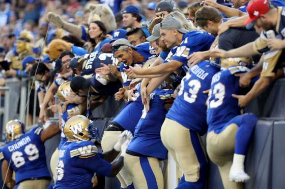 The Winnipeg Blue Bombers celebrate a touchdown by quarterback Dan Lefevour against the Edmonton Eskimos during the first half of CFL football action in Winnipeg, Thursday, August 17, 2017. THE CANADIAN PRESS/Trevor Hagan