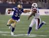 THE CANADIAN PRESS/Trevor Hagan
Winnipeg Blue Bombers running back Andrew Harris stiff arms Montreal Alouettes linebacker Dominique Tovell in a physcial, drama-filled affair in July. Harris and the Bombers are expecting more of the same when the teams play again Thursday in Montreal.