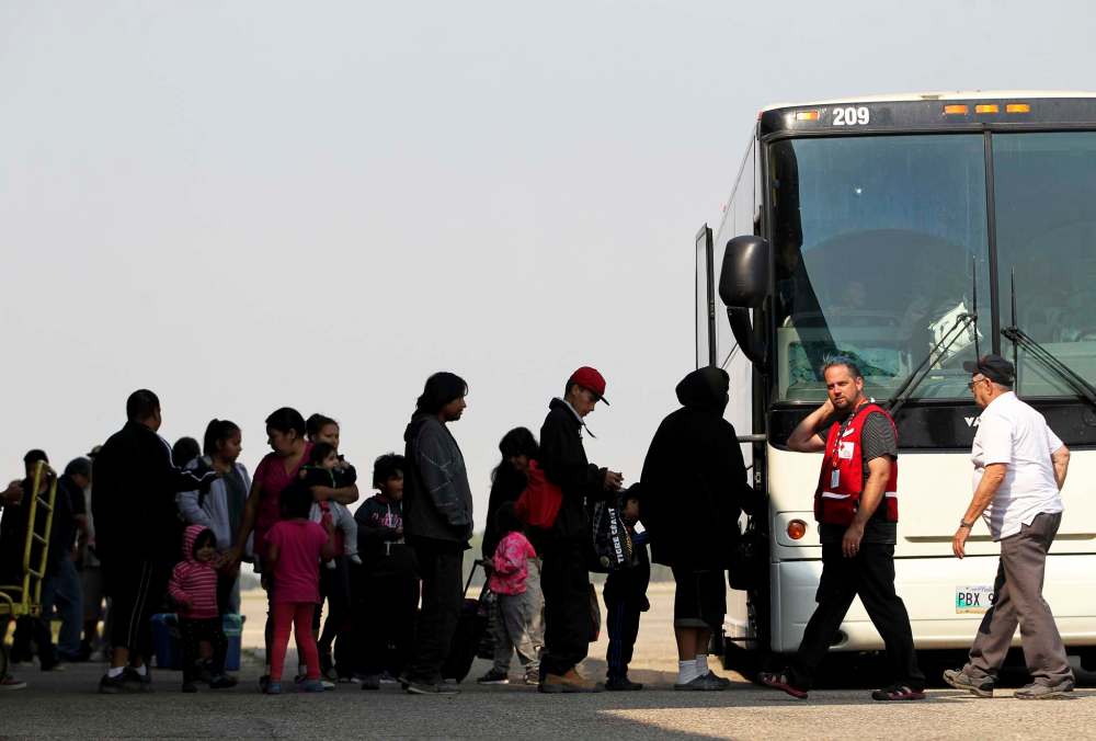 Tim Smith/The Brandon Sun
Evacuees from Island Lake area of north-eastern Manitoba arrive at the Brandon Municipal Airport on Wednesday.