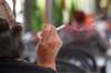 RUTH BONNEVILLE / WINNIPEG FREE PRESS
A person smokes a cigarette on a patio on Corydon Avenue.