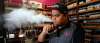 BORIS MINKEVICH / WINNIPEG FREE PRESS
Flamingo vape shop manager Mike C vapes in his shop Wednesday. The Province of Manitoba is banning the sale of vape products to minors, as well as indoor use and use in public settings.