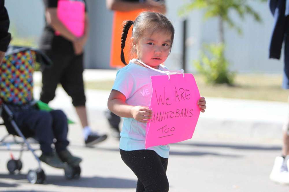 RUTH BONNEVILLE / WINNIPEG FREE PRESS
Madison Beardy, 3, from Garden Hill First Nation, walks with her family and community members during a march to demand the province to declare a state of emergency.
