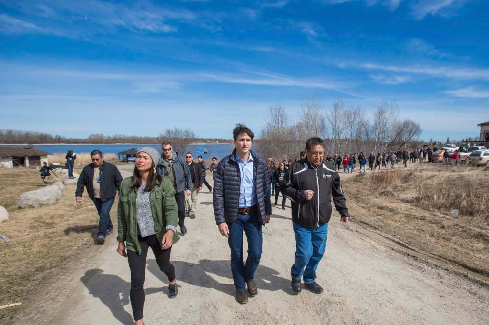 Winnipeg Free Press Files
Prime Minister Justin Trudeau visits Shoal Lake 40 with Chief Erwin Redsky in April 2016. Trudeau pledged to solve all drinking-water advisories on First Nations within five years of his election in 2015.