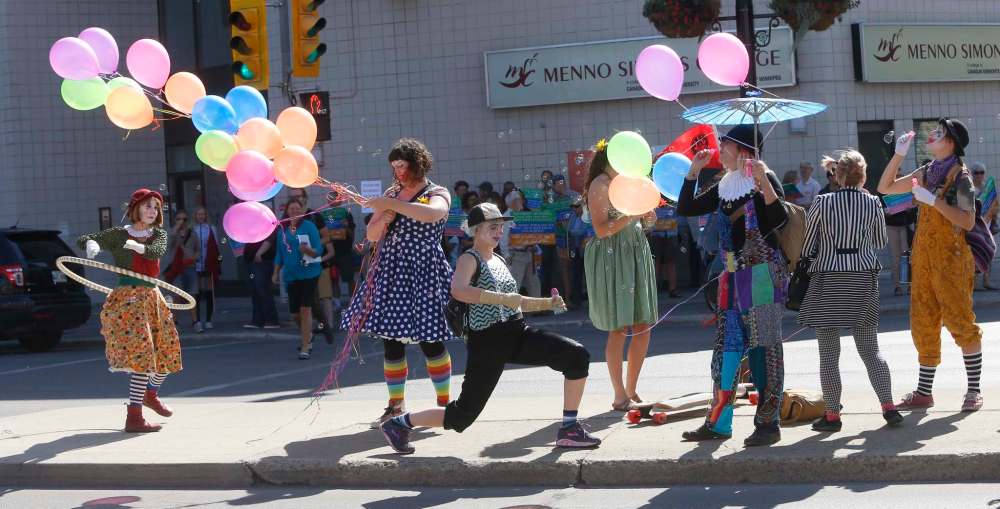 Wayne Glowacki / Winnipeg Free Press
Clowns Against Fascism join the rally Saturday on Portage Avenue.