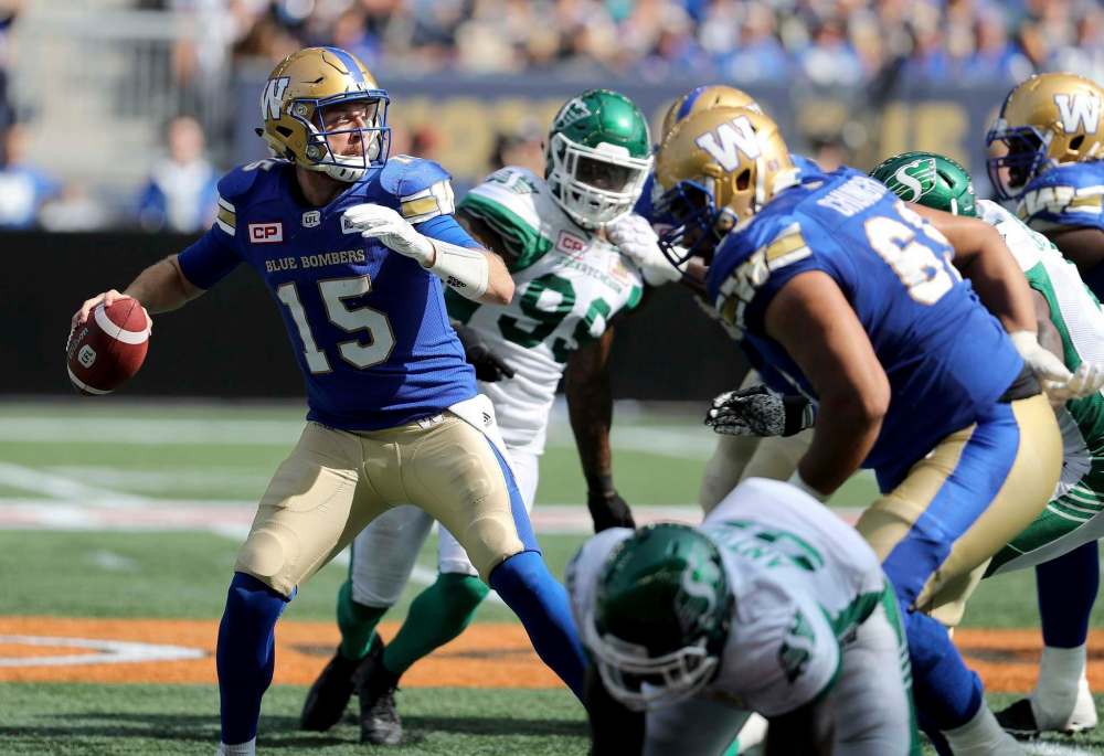 TREVOR HAGAN / THE CANADIAN PRESS
Winnipeg Blue Bombers' quarterback Matt Nichols (15) looks to pass before being sacked during the first half of CFL football action against the Saskatchewan Roughriders' in Winnipeg, Saturday, September 9, 2017.