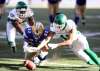 TREVOR HAGAN / THE CANADIAN PRESS
Roughriders' Tobi Antigha (92) and Kacy Rodgers III (45) battle with Bombers' Andrew Harris (33) to recover a fumble during the second half.