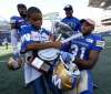PHOTOS BY TREVOR HAGAN / THE CANADIAN PRESS
Malik Leggett (left), 9, celebrates with his dad, Winnipeg Blue Bombers' Moe Leggett (31).