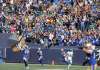 Fans cheer as Winnipeg Blue Bombers' Moe Leggett (31) returns a punt for a touchdown against the Saskatchewan Roughriders'. (Trevor Hagan / The Canadian Press)