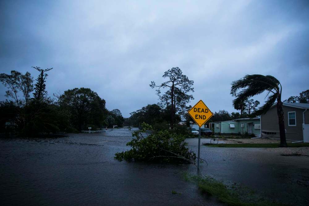 NICOLE RAUCHEISEN / NAPLES DAILY NEWS VIA AP
Floodwater fills Meadow Lane in Bonita Springs, Fla., Sunday, Sept. 10, 2017, as Hurricane Irma passes.