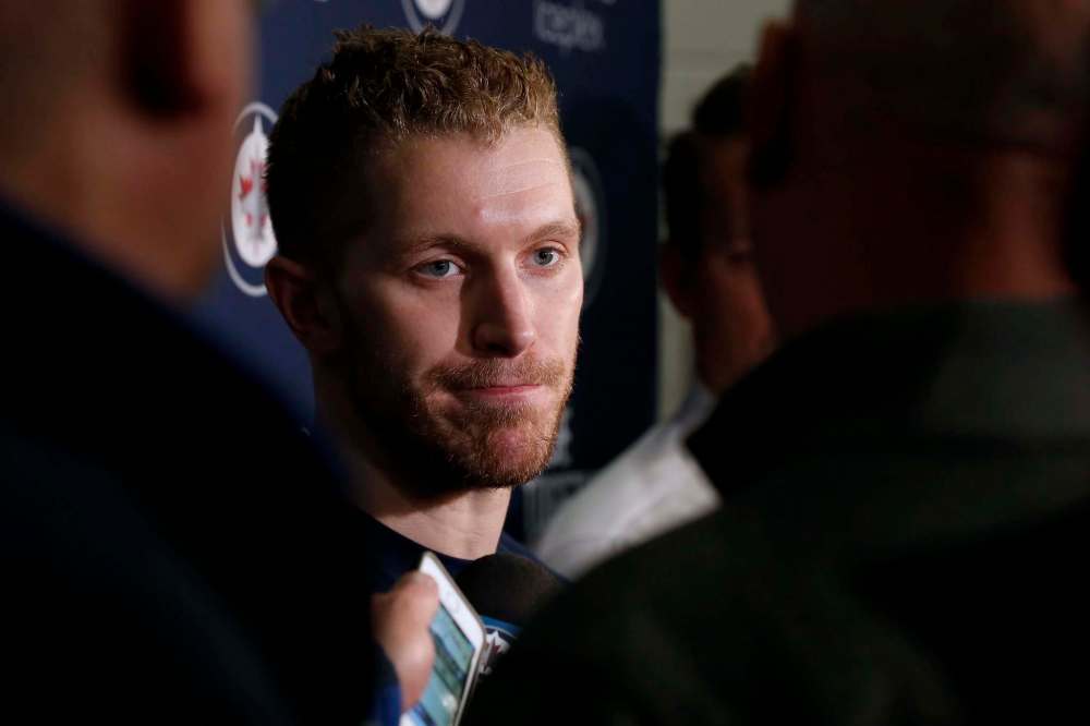 The Canadian Press/John Woods
Winnipeg Jets' Bryan Little talks to media after signing a multi-year contract on opening day of the Jets' training camp Thursday, September 14, 2017 in Winnipeg.