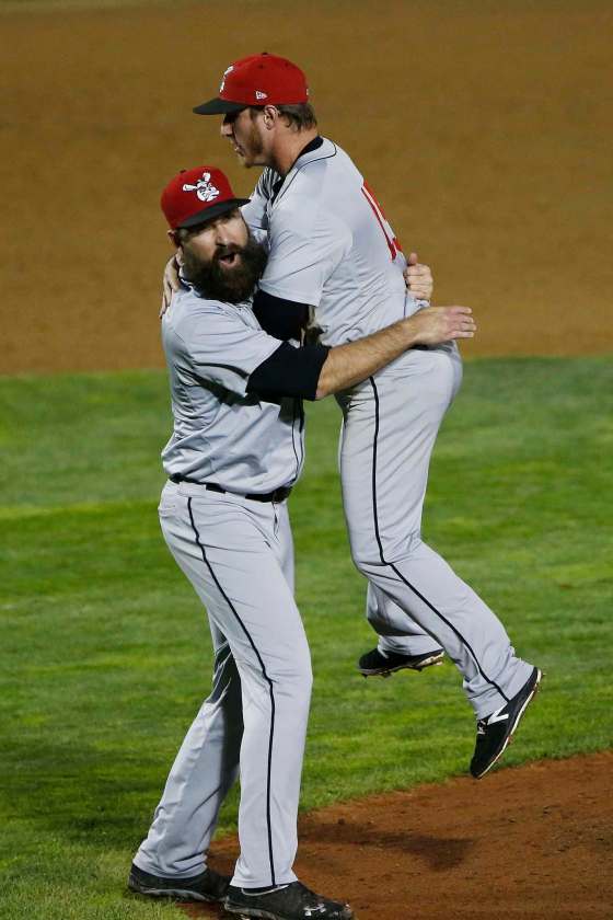Wichita Wingnuts pitcher Ryan Kussmaul (31) celebrates prematurely with teammate TJ Mittelstaedt (15) thinking they defeated the Winnipeg Goldeyes in game four of the championship series in Winnipeg Monday, September 18, 2017. The ump ruled that the batter tipped the ball and not a strike. (John Woods / Winnipeg Free Press)