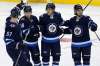 Winnipeg Jets' Tyler Myers (57), Bryan Little (18), Nikolaj Ehlers (27) and Nic Petan (19) celebrate Ehlers' goal against the Edmonton Oilers during first period NHL pre-season game action in Winnipeg on Wednesday, September 20, 2017. THE CANADIAN PRESS/John Woods