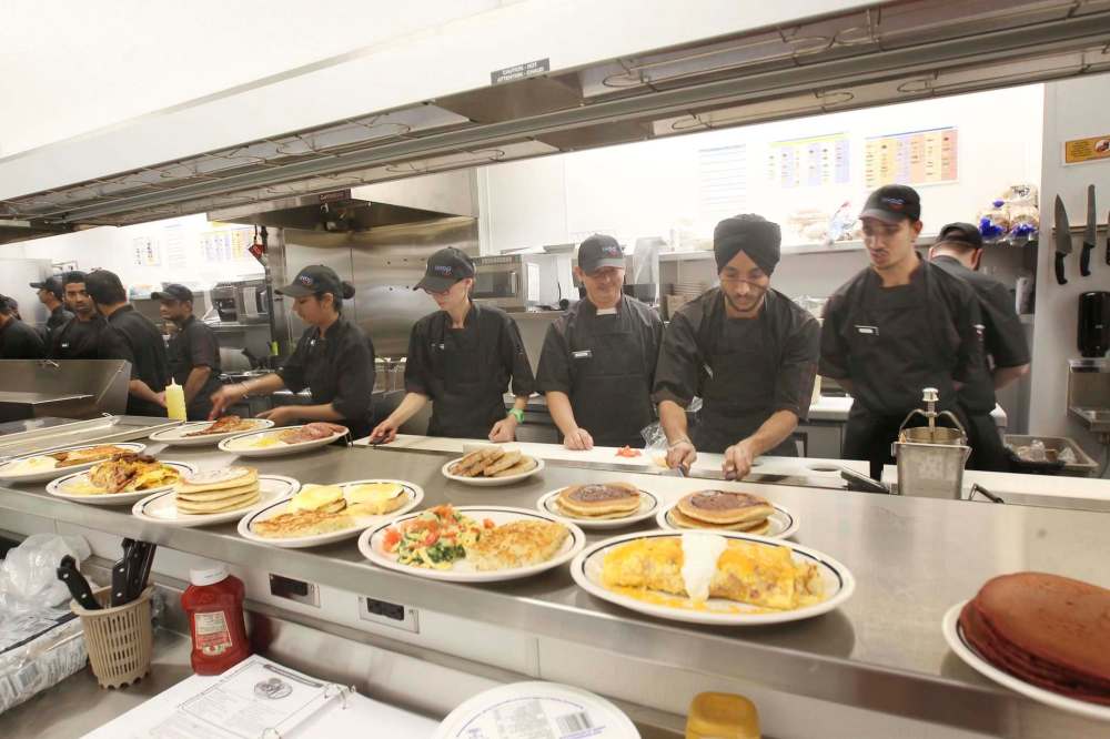 JOE BRYKSA / WINNIPEG FREE PRESS
Line chefs busy training Thursday at the new IHOP restaurant set to open Sept. 25.