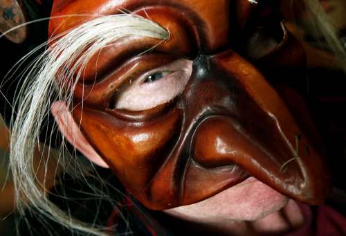 PHIL HOSSACK / WINNIPEG FREE PRESS
Chris Sigurdson peers out from behind one of his Commedia dell'arte masks.