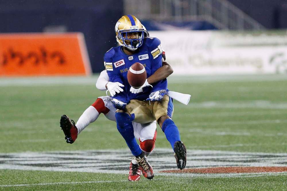 John Woods
/ The Canadian PressWinnipeg Blue Bombers’ Darvin Adams (1) makes the catch despite the pass interference call against the Ottawa Redblacks player during the second half of CFL action in Winnipeg Friday, September 22, 2017.