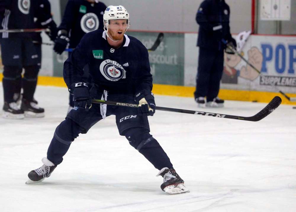 BORIS MINKEVICH / WINNIPEG FREE PRESS FILES
Forward Kyle Connor played alongside Blake Wheeler and Mark Scheifele against the Calgary Flames on Monday.