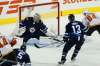 JOHN WOODS / WINNIPEG FREE PRESS
Jets goaltender Steve Mason moves to block a shot by the Flames’ Joseph Cramarossa as Brandon Tanev defends during a preseason contest on Monday.
