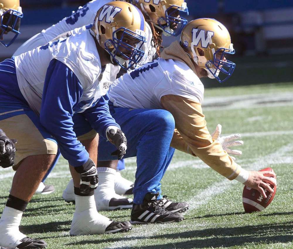 JOE BRYKSA / WINNIPEG FREE PRESS
Sukh Chungh, left, and Matthias Goossen during practice at Investors Group Field. The two are part of a line that protects the league’s most successful offense.