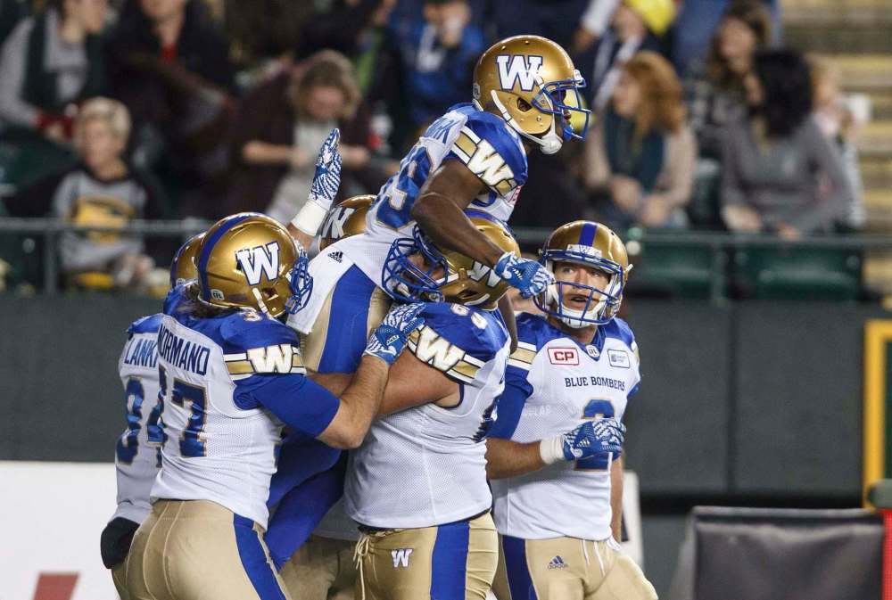 JASON FRANSON / THE CANADIAN PRESS
Winnipeg Blue Bombers players celebrate a touchdown against the Edmonton Eskimos during first half CFL action in Edmonton, Alta., on Saturday September 30, 2017.